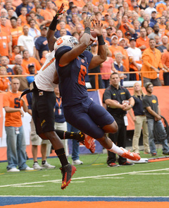 Darius Kelly (right) fights for a ball with Stefon Diggs (left) during Syracuse's 34-20 loss to Maryland in the Carrier Dome Saturday. Diggs caught one pass for 12 yards in the game.