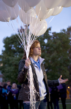 Hailey Temple, a senior public relations and  information management and technology dual major and 2014 Remembrance Scholar, began the event by releasing a bundle of white balloons and explaining the meaning behind the event. 