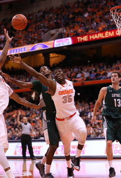 SU center Chinonso Obokoh makes an attempt for a loose ball.