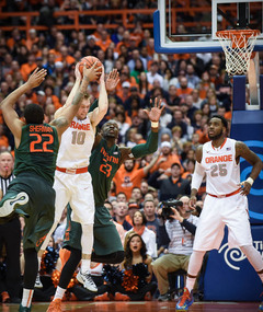Omar Sherman tries to strip the ball from Trevor Cooney, who had four of SU's 13 turnovers. 