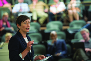Katie McDonald, associate professor in public health and a faculty fellow at the Burton Blatt Institution, addresses the crowd in attendance during the Syracuse Strategic Plan Steering Committee meeting at Syracuse University's Maxwell Auditorium, Sept. 30, 2014.