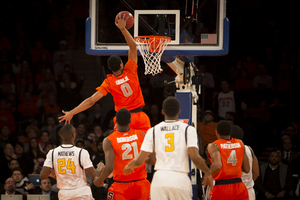 Michael Gbinije slams home a fastbreak dunk in Madison Square Garden. The forward had a few chances to put No. 23 Syracuse back in the game on Thursday night, but he couldn't convert in what turned out to be a 73-59 loss to unranked California. 