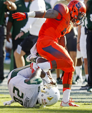 USF's Devin Abraham comes down with his team's own punt after it bounced off SU's Kielan Whitner, who was standing close to returner Brisly Estime (9).