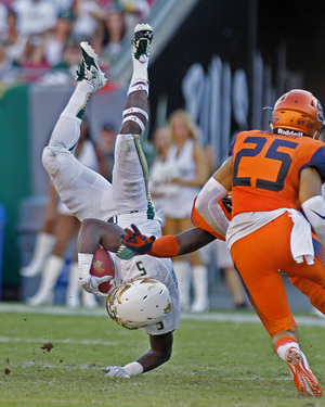 Syracuse freshman safety Kielan Whitner (25) watches as running back Marlon Mack falls to the ground. Whitner's stock dipped after SU's 21-point loss to USF.