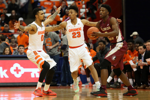 Michael Gbinije (0) and Malachi Richardson helped the Orange shut down Florida State in the second half as Syracuse pulled away.