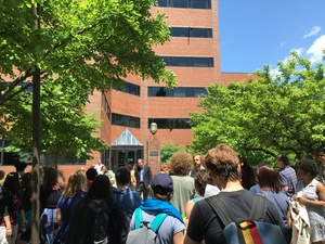 Syracuse University community members gathered on campus Tuesday to protest the University Place promenade. The group of about 40 people marched to Crouse-Hinds Hall and were met by Kevin Quinn, SU's senior vice president for public affairs.