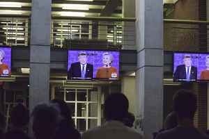 Syracuse University students gathered at Joseph A. Strasser Commons in Eggers Hall to watch a presidential debate on Monday night. 