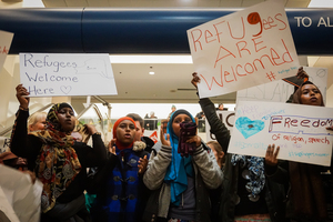 Many Syracuse residents, including Khadijo Abdulkadir, gathered at the Syracuse Hancock International Airport on Sunday night to protest Trump's refugee ban.