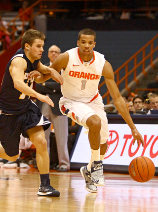 Michael Carter-WIlliams dribbles the ball up court against pressure Thursday night in Syracuse's exhibition game against Pace.