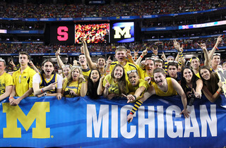 Michigan fans cheer on the Wolverines.