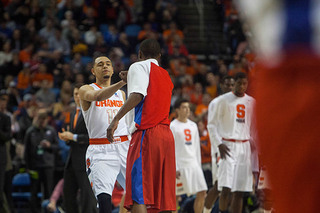 SU point guard Tyler Ennis says hello to a Dayton player at half court. 