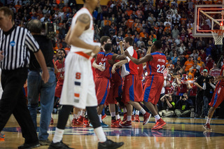 Dayton celebrates its upset victory and advancement to the Sweet 16. 