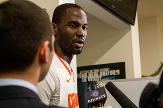 Keita, after playing in his final collegiate game, talks to reporters. 