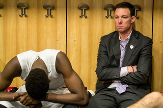 Grant (left) and assistant coach Gerry McNamara (right) take in a crushing defeat to the Flyers, and elimination from the NCAA Tournament after a 25-0 start. 
