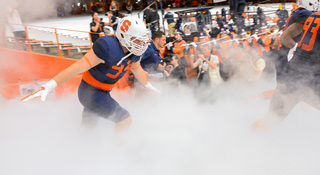 Syracuse players come out of the tunnel before the Orange's 34-20 loss to Maryland in the Carrier Dome Saturday.