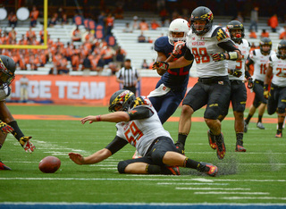 Maryland's Christian Carpenter attempts to fall on a ball during the Terrapins' 34-20 win against Syracuse Saturday in the Carrier Dome.