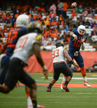 Terrel Hunt throws downfield under pressure from Andre Monroe. Hunt completed 14 of his 28 passes, had one picked off for a Maryland touchdown and threw for 219 yards in Syracuse's 34-20 loss Saturday in the Carrier Dome.