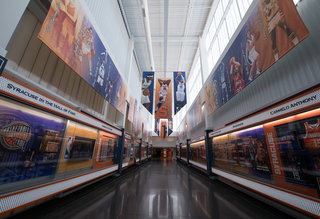 The Melo Center hallway features championship trophies, pictures of former players and televisions running the 2003 National Championship game on repeat. 