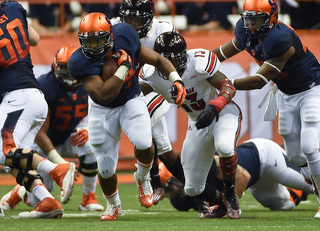 SU running back Adonis Ameen-Moore looks to reach the second level.