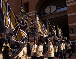 Members of the Wake Forest band greet players as they walk toward BB&T Field in Winston-Salem, North Carolina.