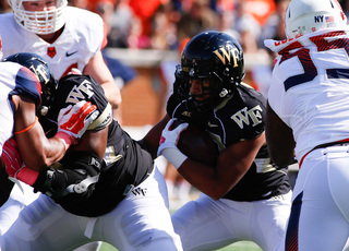 Ryan Sloan looks to make a tackle on a Wake Forest running back. 