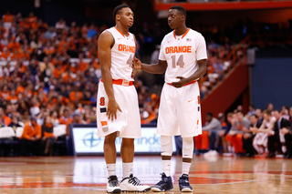 Ron Patterson (left) and Kaleb Joseph (right) talk at mid-court.