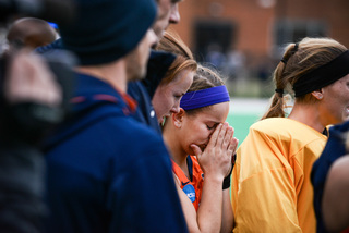 A Syracuse player covers her face after losing to UConn in Sunday's national championship. SU had a penalty corner with 21 seconds left but failed to convert. It would've tied the game at 1-1.