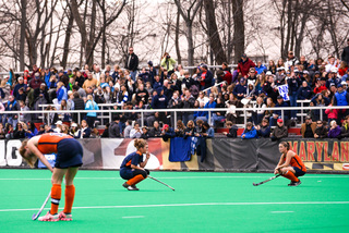 Syracuse players drop toward the ground after the final whistle of their 1-0 loss to UConn in Sunday's national championship.