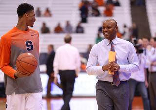 SU freshman forward Chris McCullough chats with assistant coach Adrian Autry before Tuesday night's game.