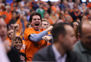 Marchello Chacchia and son Cayman Chacchia cheer during the Syracuse-Loyola game.