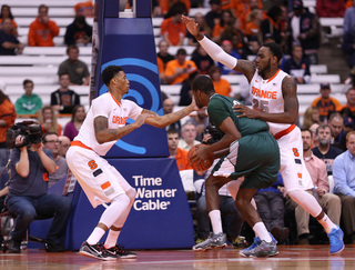 McCullough gets a hand on the face of a Greyhound while senior forward Rakeem Christmas defends from the other side.