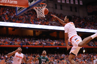 Gbinije lofts an alley-oop pass for Patterson in the second half.