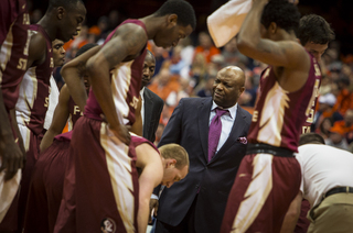 Leonard Hamilton approaches his team during a timeout. The Seminole's shot just 2-of-16 from 3. 