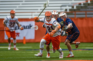 Mike Messina runs with the ball as Virginia players chase him down. 
