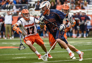 Dylan Donahue looks to take away possession from Virginia. 