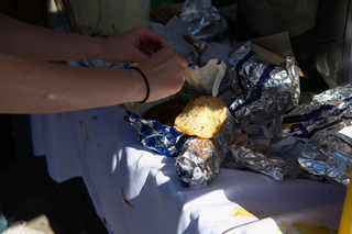 Concert goers enjoyed greasy fried food including hamburgers.