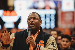 Syracuse football head coach Dino Babers and the Orange football team were honored at halftime. Babers urged the crowd to support the team by attending the Camping World Bowl game in Orlando, Florida on Dec. 28. 